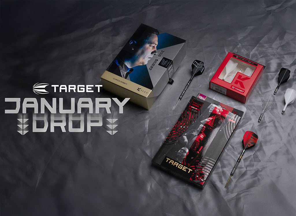Collection of Target brand darts and packaging on a textured gray surface with 'January Drop' text.