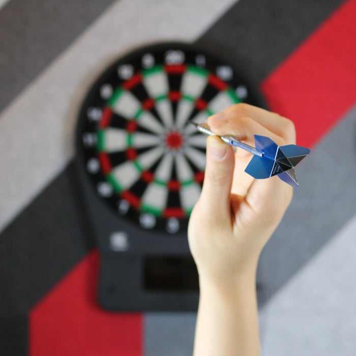 Hand aiming dart at board