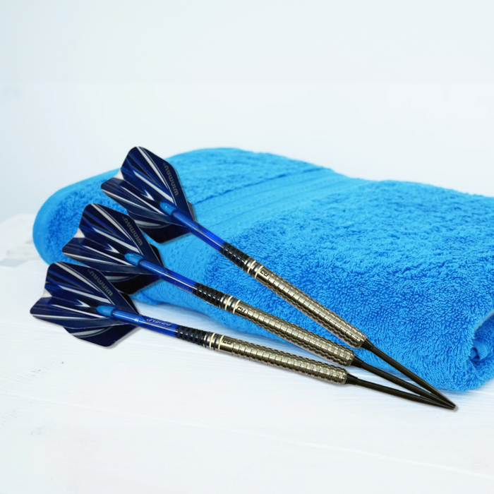 three darts on a blue towel