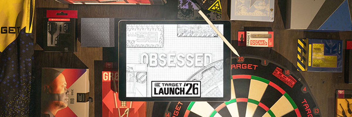 A Target Launch 26 promotional sign or poster displayed in a themed retail environment, surrounded by dartboards, dart boxes, and other retail decor.